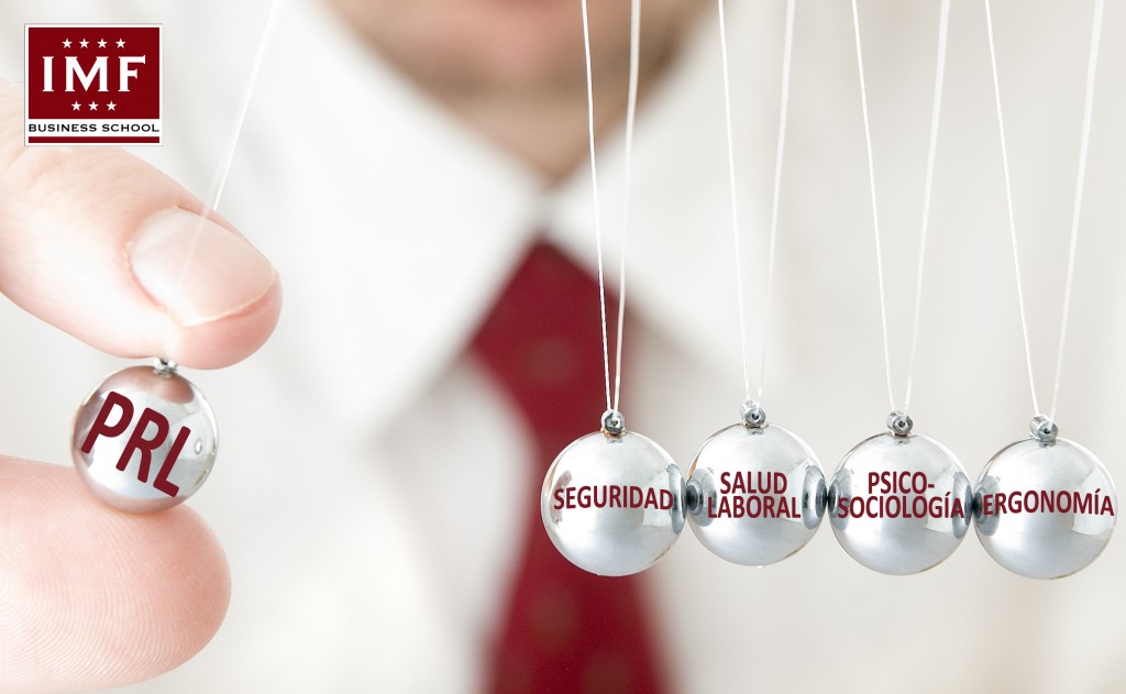 Businessman hand holding a pendulum ball